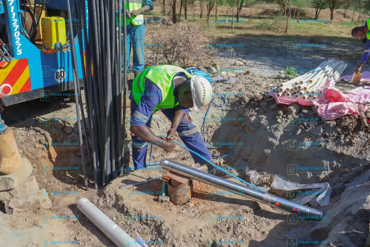 Aqua Hub Kenya technicians install submersible pump for borehole